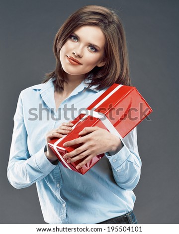 Happy woman hold gift box. Studio portrait of young business woman.