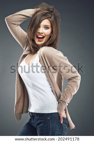 Isolated smiling woman portrait. Casual dressed young model. Studio isolated background