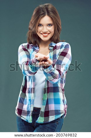 Smiling Woman show empty hand. Isolated portrait of female model.