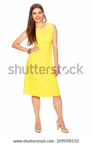 Full body portrait of young woman in yellow dress. White background.