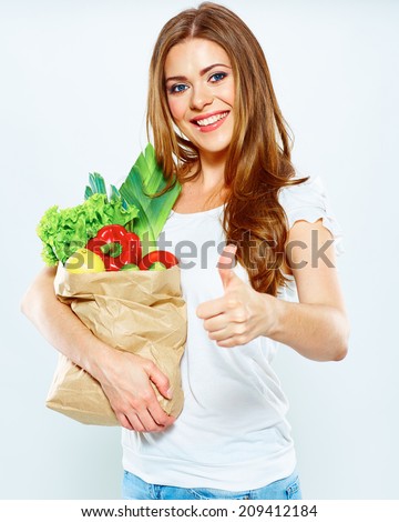 Smiling Happy woman hold green vegan food. Thumb up.White  Isolated Portrait.