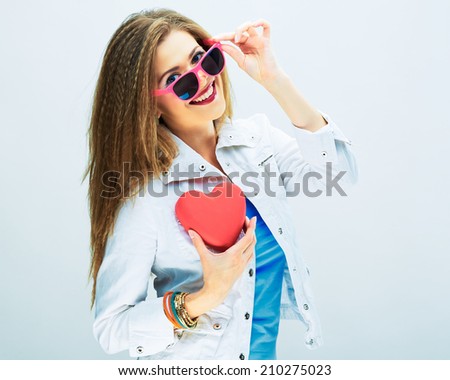 flirting woman with long hair hold red heart . white background .