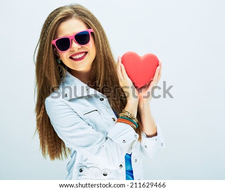 smiling woman with long hair hold red heart . white background .