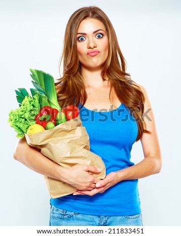 funny woman with green food. vegan portrait.