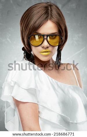 Beauty face portrait of sexy model with yellow sun glasses. Face. Beautiful model.
