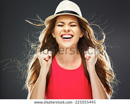 happy woman portrait. toothy smile. female model in red dress.