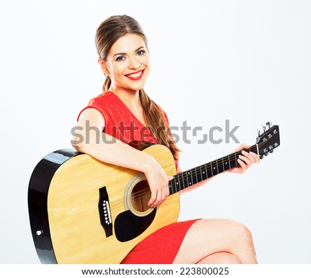 young woman play music . isolated portrait of female model with guitar .
