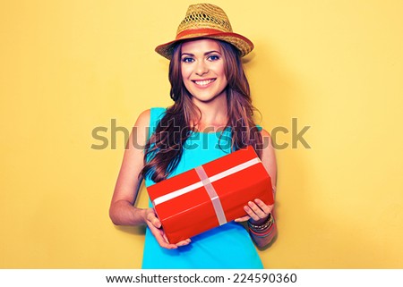 fashion model posing with gift box. woman portrait. long hair .