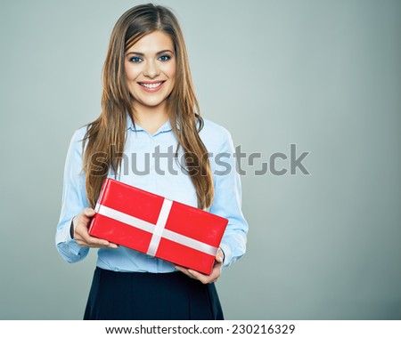 Happy woman hold red gift box. Business woman portrait isolated. Studio.