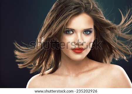 Hair style smiling woman portrait. Beautiful model  with long blowing hair.