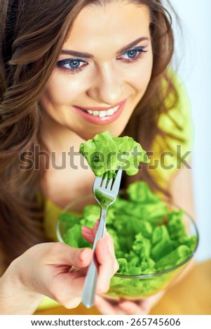 close up face portrait of woman for female healthy diet concept. woman eating salad.