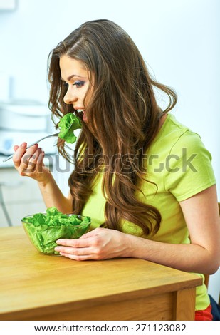 woman eating salad with pleasure. diet with joy emotion.