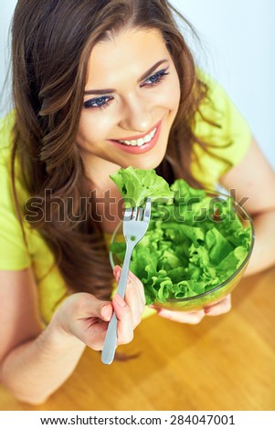 close up face portrait of woman for female healthy diet concept. woman eating salad.