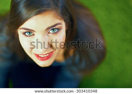 Close up face portrait of smiling girl. Beautiful eyes. Long hair.