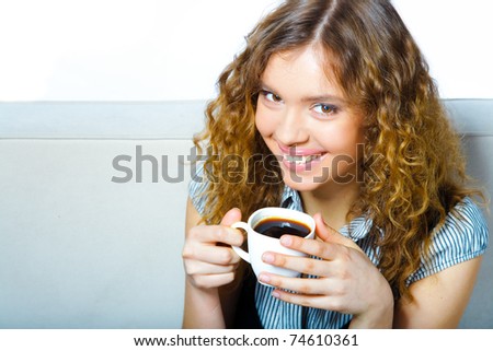 close-up portrait of young smiling woman portrait with coffee cup - indoor - drinking