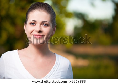 Happy  Woman on summer tree background. Outdoor portrait with big smile.