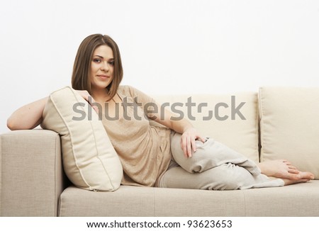 young girl portrait sitting on a sofa. indoor relax at home. beautiful woman