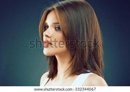 Beauty profile portrait of young woman. Green isolated background.