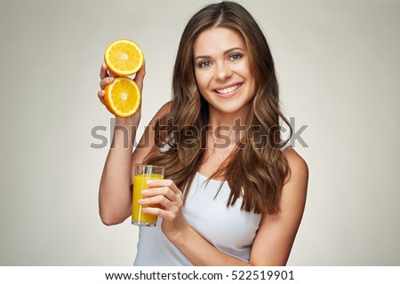 smiling woman holding orange juice and fruit. vitamin drink. isolated portrait.