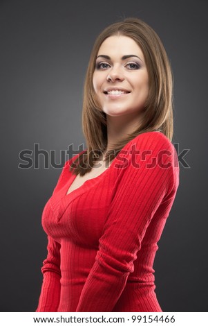 Isolated woman portrait. Smiling and happy girl over gray background