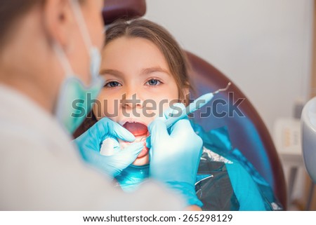 Little cute caucasian girl during visit in dental office
