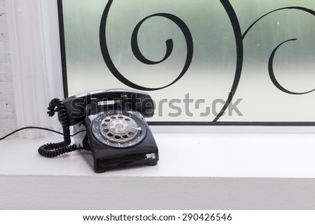 old telephone on window light