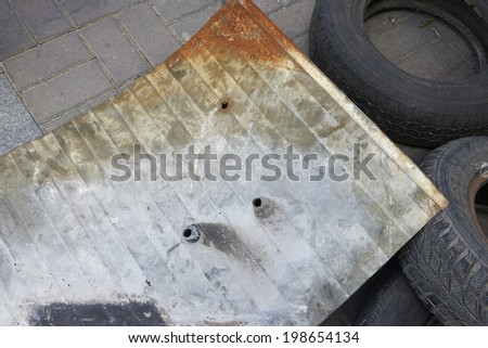 KIEV, UKRAINE - June 13, 2014: Kiev Maidan after the revolution of dignity. Thin tin-plate shield protester with holes