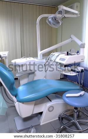 Modern dentist\'s chair in a medical room.