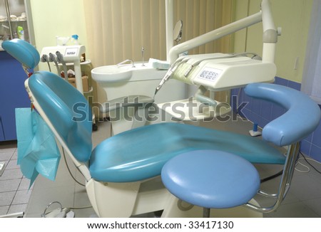 Modern dentist\'s chair in a medical room. HDR image.