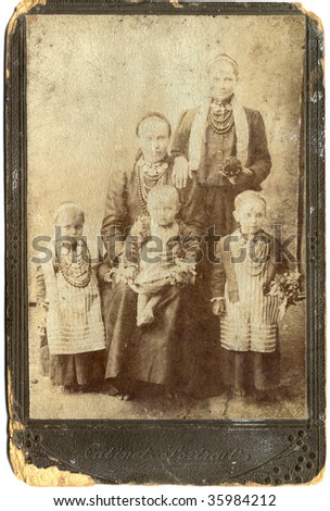 An old family photograph, Ukraine (in the Tsarist Russia Empire), the late 19 th century and beginning of 20 century. Only women and children without men. In old frame