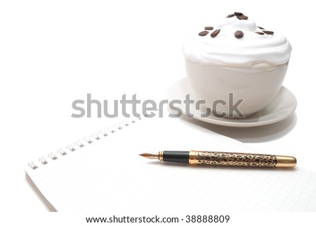 Coffee with ice-cream in cup around with a pad and pen