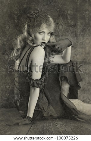 black and white vintage portrait on retro background. woman biting her finger.