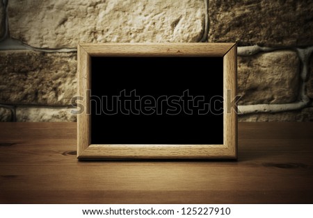 Old Photo Frame On The Wooden Table