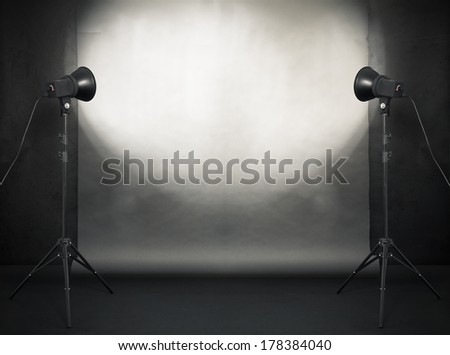 Photo Studio In Old Grunge Room With Concrete Wall And Paper Background