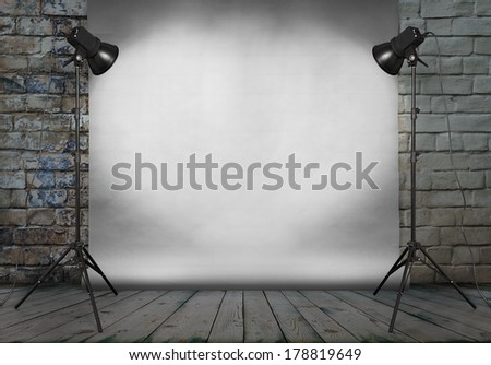 photo studio in old grunge room with brick wall and paper background