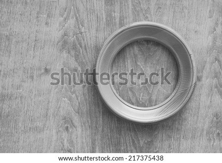 blank circle photo frame on old wooden gray wall