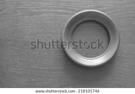 blank circle photo frame on old wooden gray wall