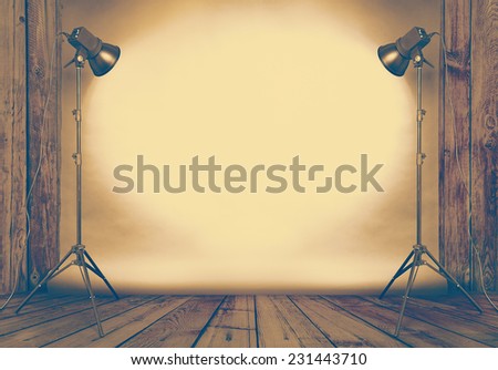 photo studio in old wooden room with concrete wall and paper background , retro filtered, instagram style