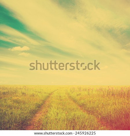 country road in the fields, bright fantasy background, retro film filtered, instagram style