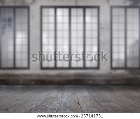 vintage blurred background. old room with concrete wall, wooden floor and big windows