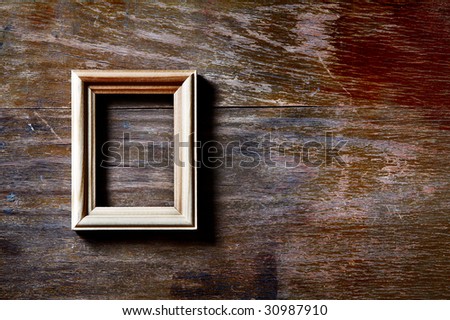 empty photo-frame on wooden background