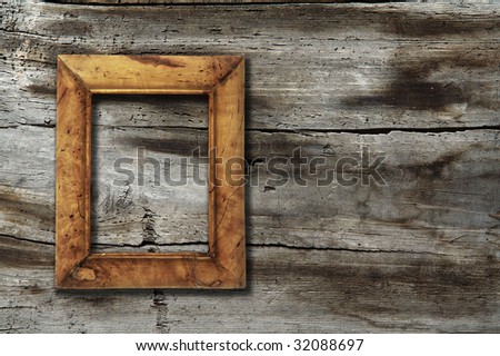 blank photo-frame on old wooden background