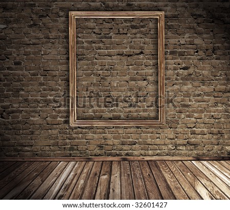old grunge interior with blank picture frame against wall