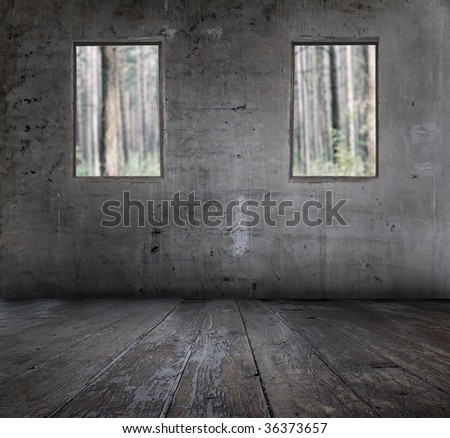old grunge interior with windows overlooking the forest