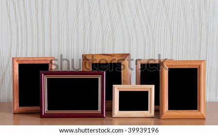 photo frames on wooden table