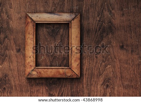 old frame on old wooden background