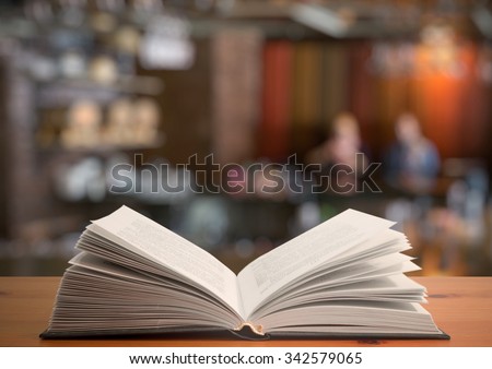 open book on the table in a night club