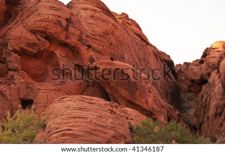 Stone formation in the Valley of Fire in the form of sitting in the nest red bird