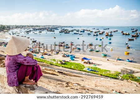 Vietnamese Girl beside the beach , Slow life , Mui Ne Fishing village
