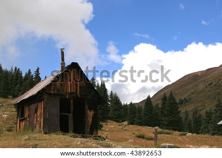 Rustic cabin on treeline